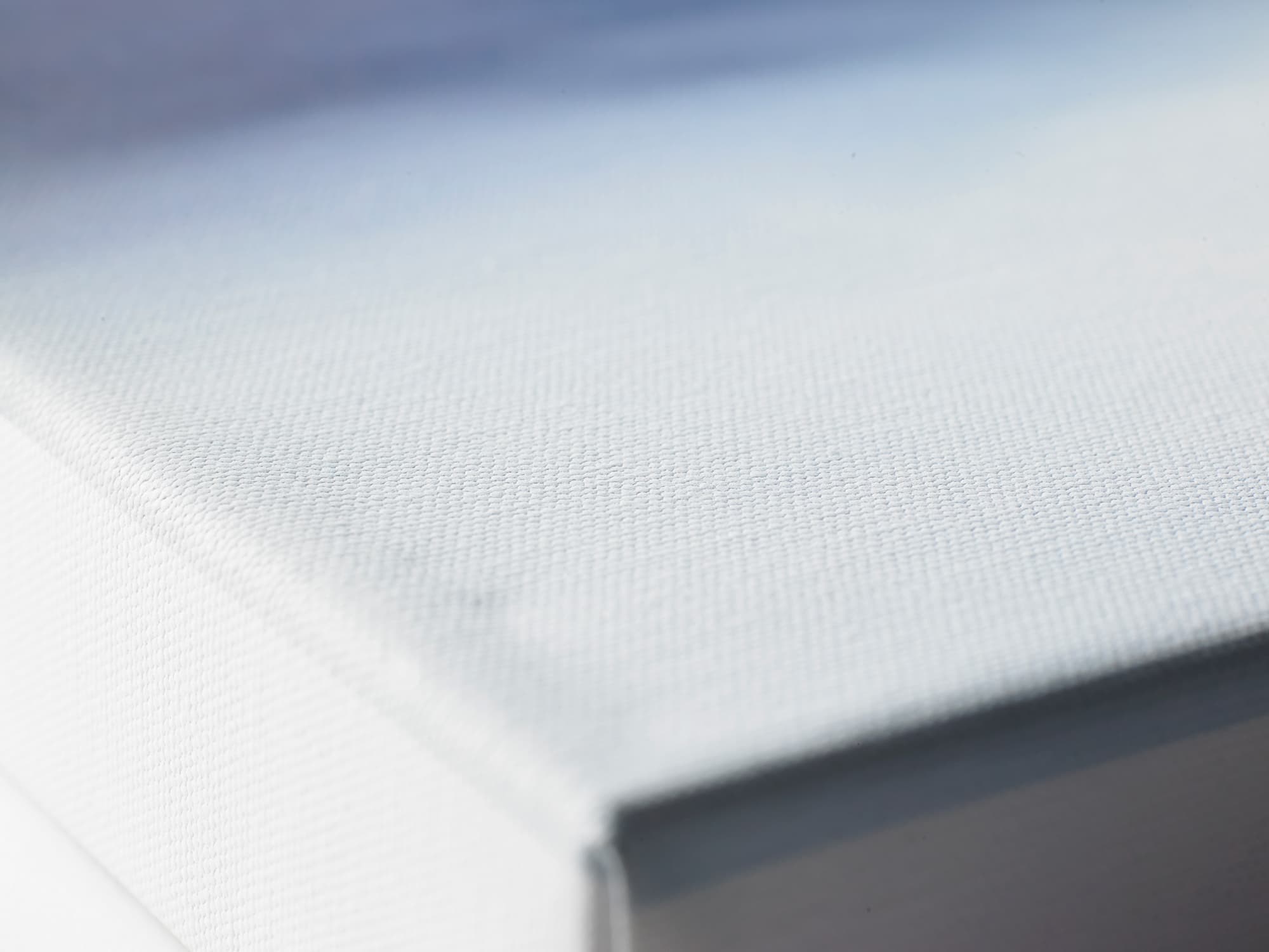 Macro of the woven 400gsm artist-grade canvas texture.