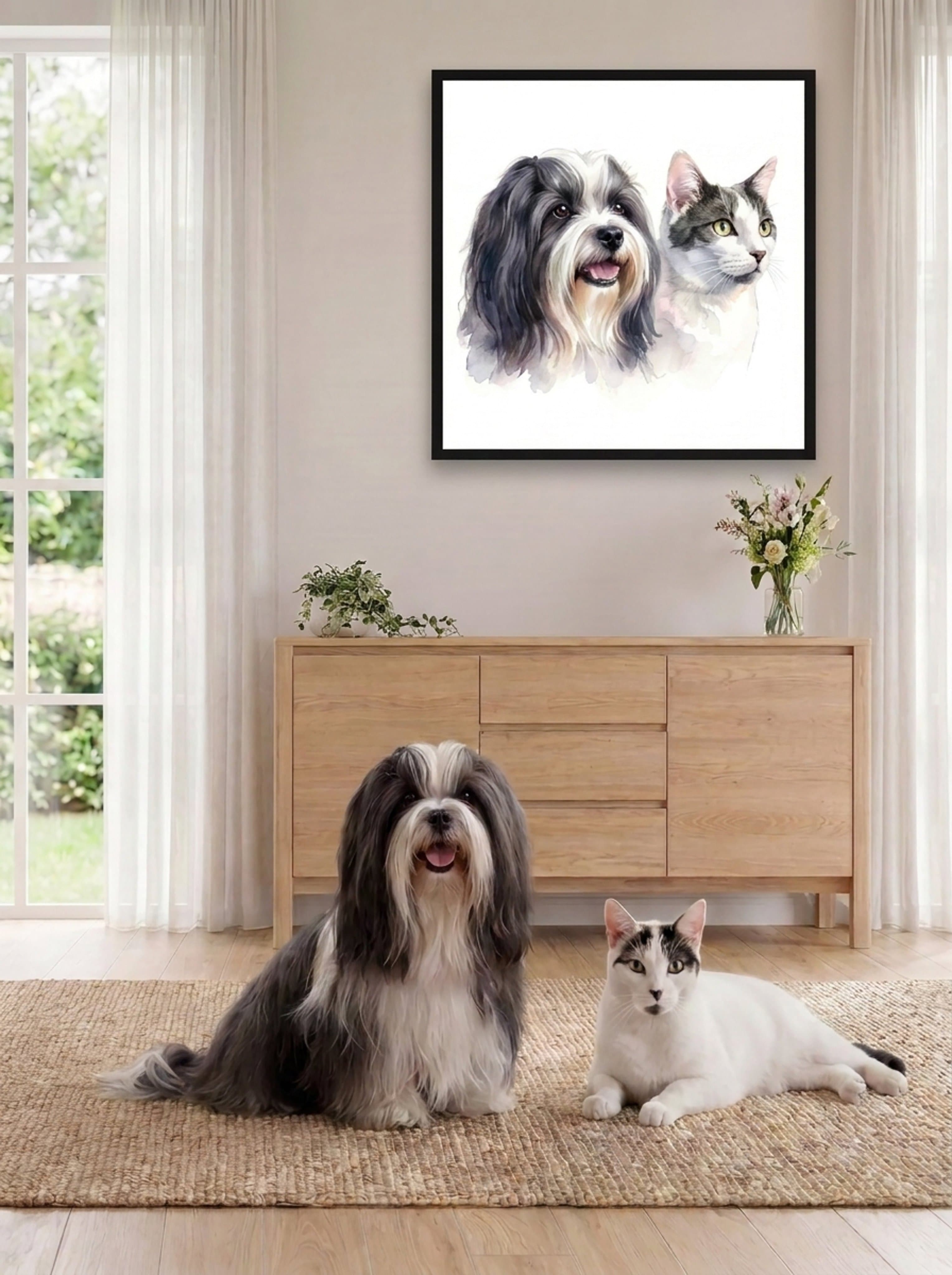 A dog and a cat in a bright, sunlit living room, their framed watercolor portrait hanging on the wall above a wooden credenza.